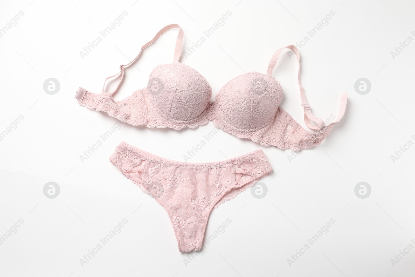 Photo of Elegant pink lace women's underwear isolated on white, top view