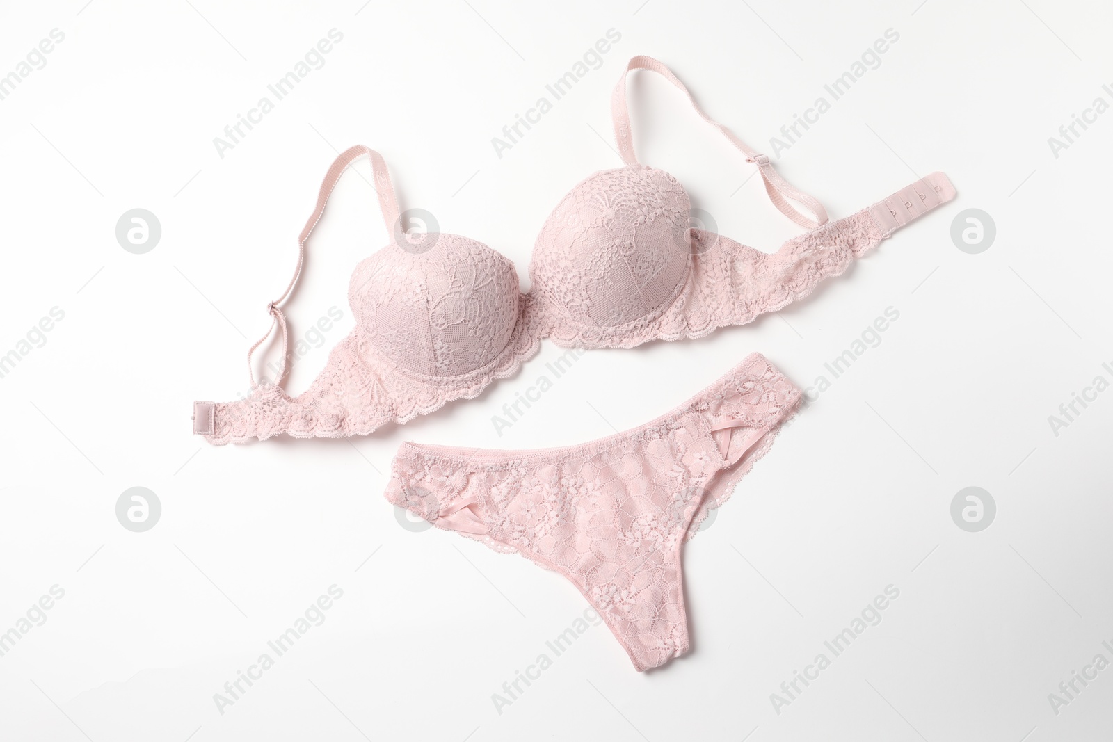 Photo of Elegant pink lace women's underwear isolated on white, top view