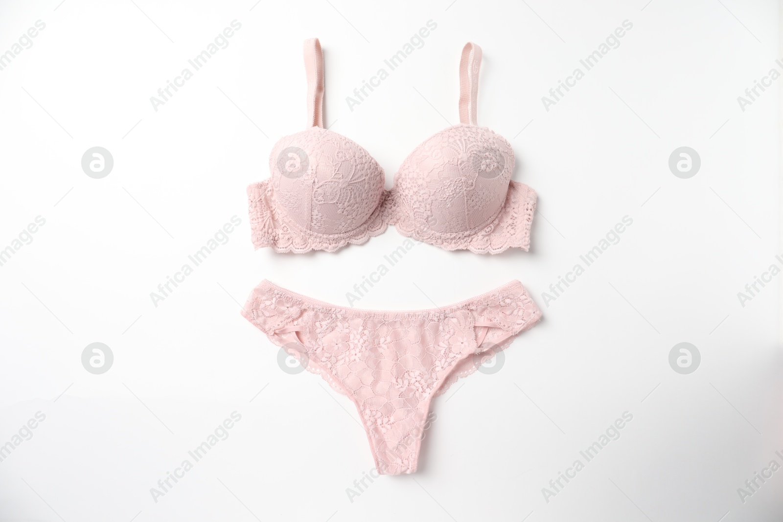 Photo of Elegant pink lace women's underwear isolated on white, top view