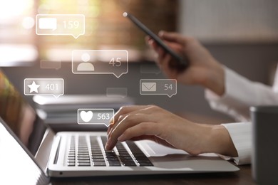 Image of Content manager. Woman working on laptop and smartphone indoors, closeup. Likes, followers, e-mails, messages and adding to favorite notifications over device