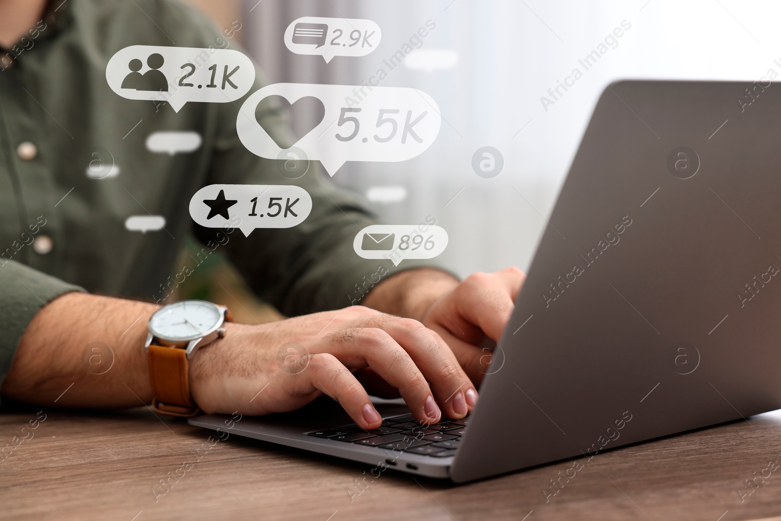 Image of Content manager. Man working on laptop indoors, closeup. Likes, followers, e-mails, messages and adding to favorite notifications over device