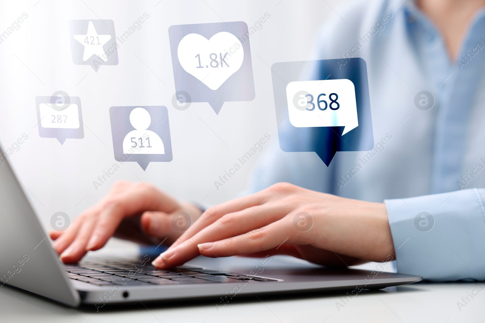 Image of Content manager. Woman working on laptop indoors, closeup. Likes, followers, e-mails, messages and adding to favorite notifications over device