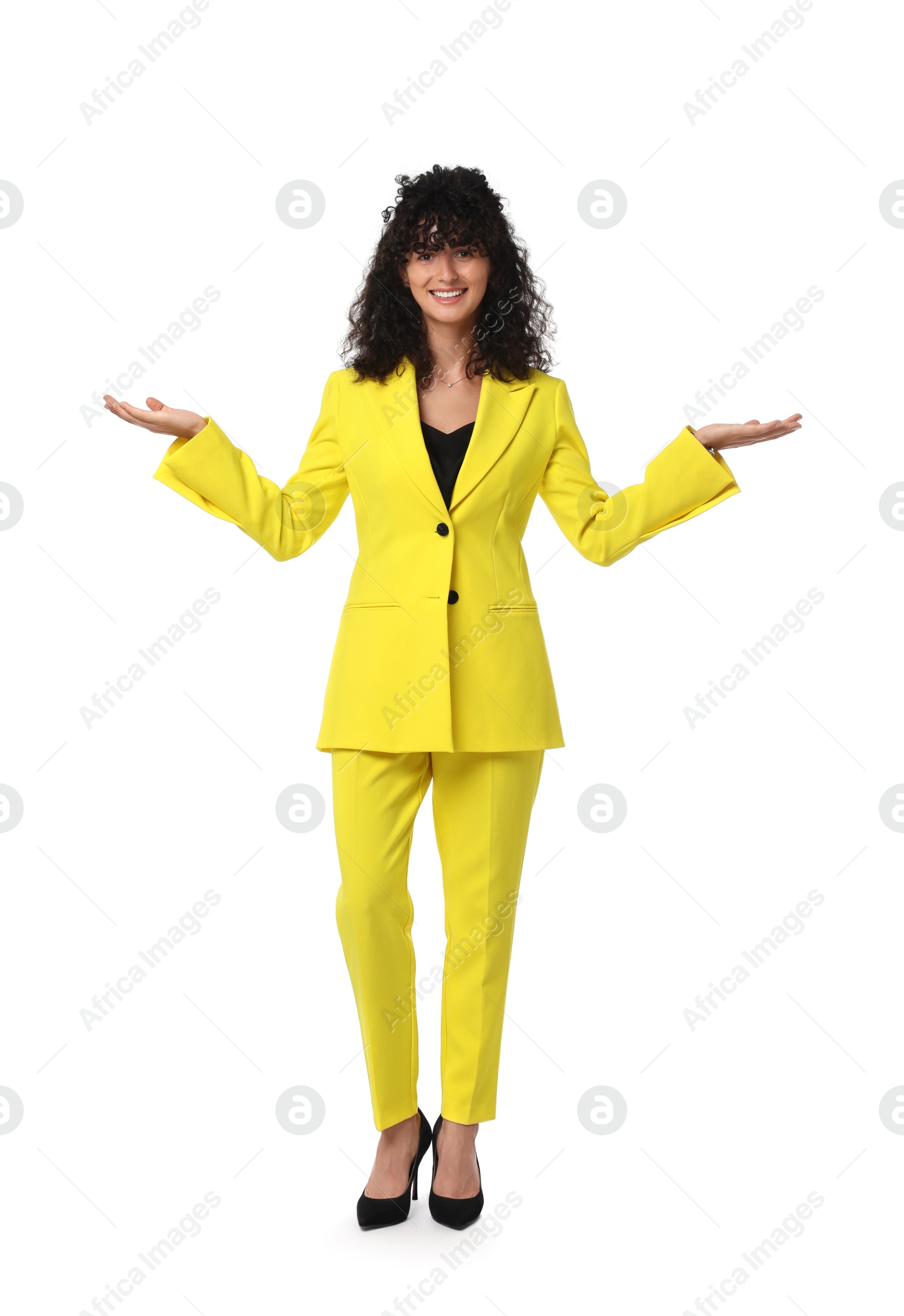 Photo of Beautiful young woman in stylish yellow suit isolated on white