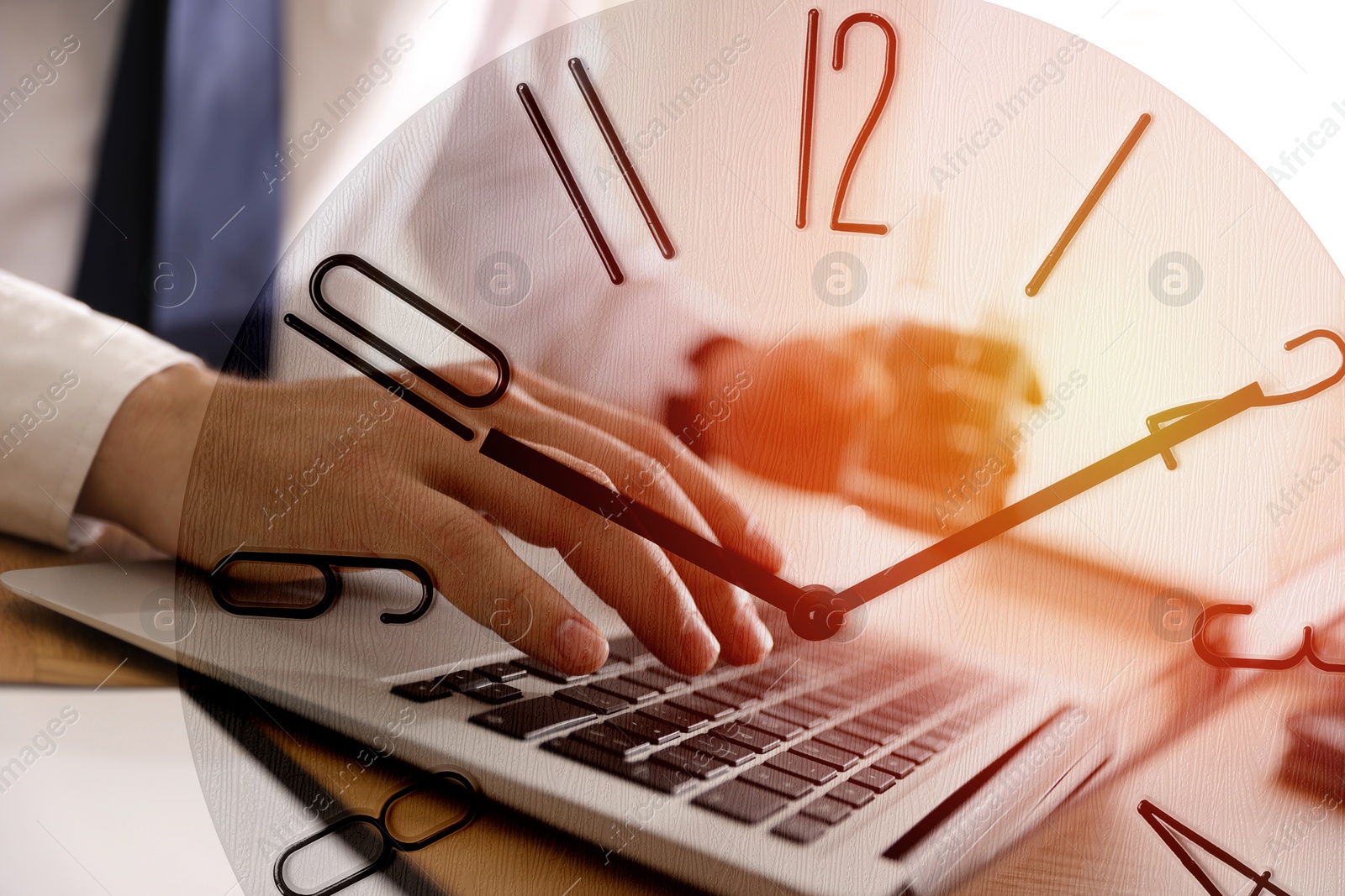 Image of Businessman working on laptop at table, clock, double exposure. Time management