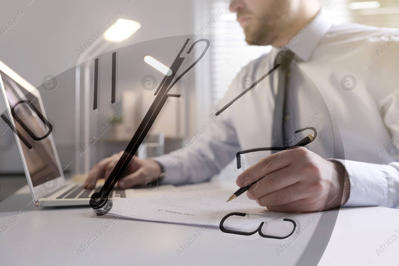 Image of Businessman working on laptop at table, clock, double exposure. Time management