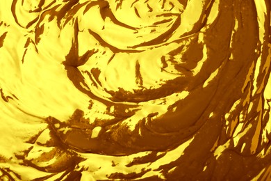 Image of Texture of gold fluid as background, closeup