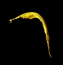 Image of Splash of gold fluid on black background