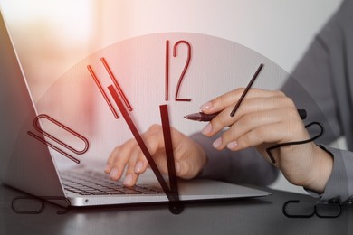 Image of Businesswoman working on laptop at table, clock, double exposure. Time management