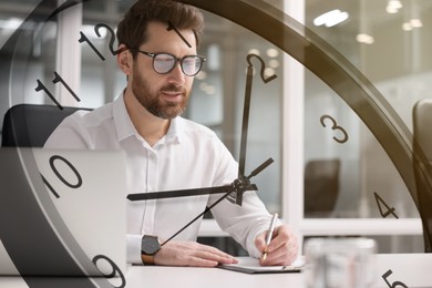 Image of Businesswoman working in office, clock, double exposure. Time management