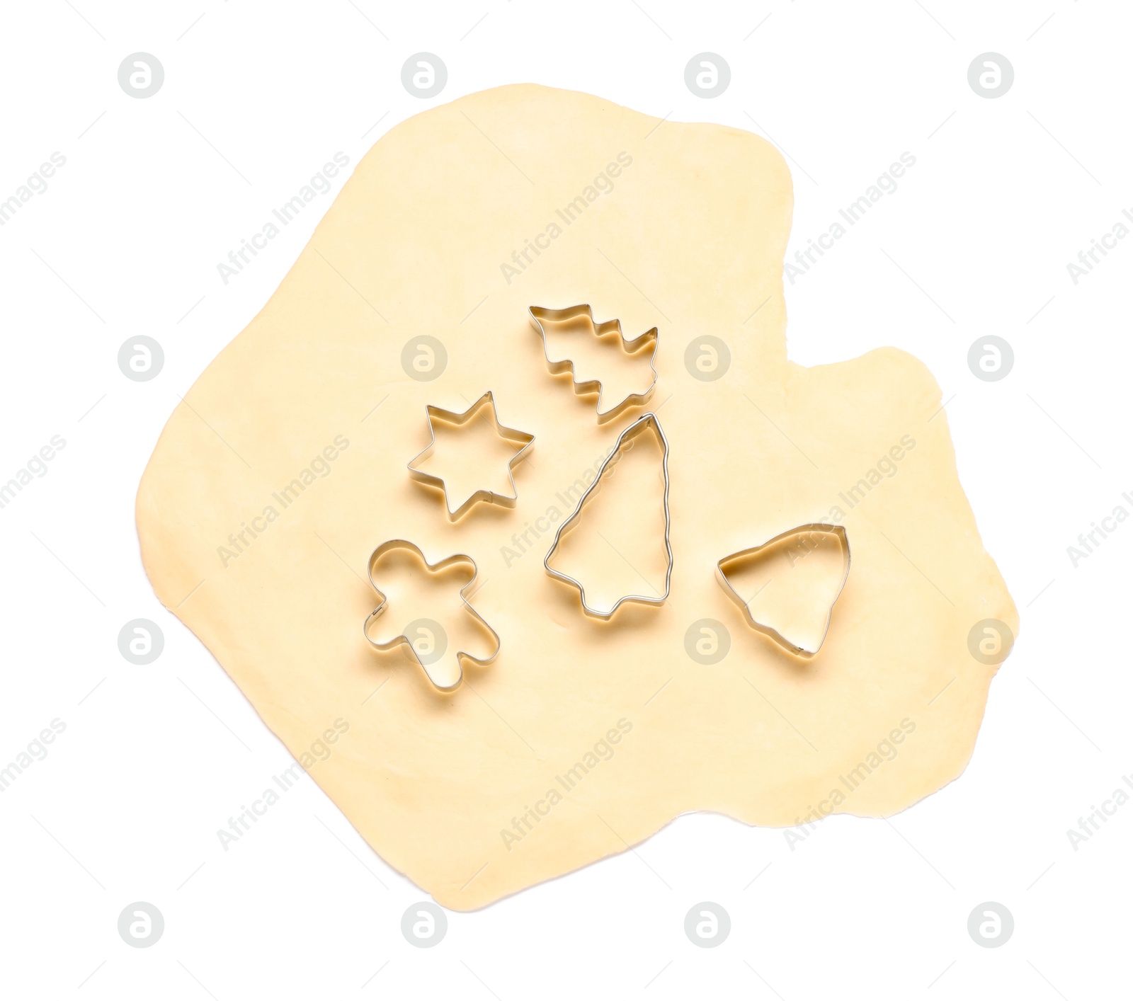 Photo of Raw dough and cookie cutters isolated on white, top view