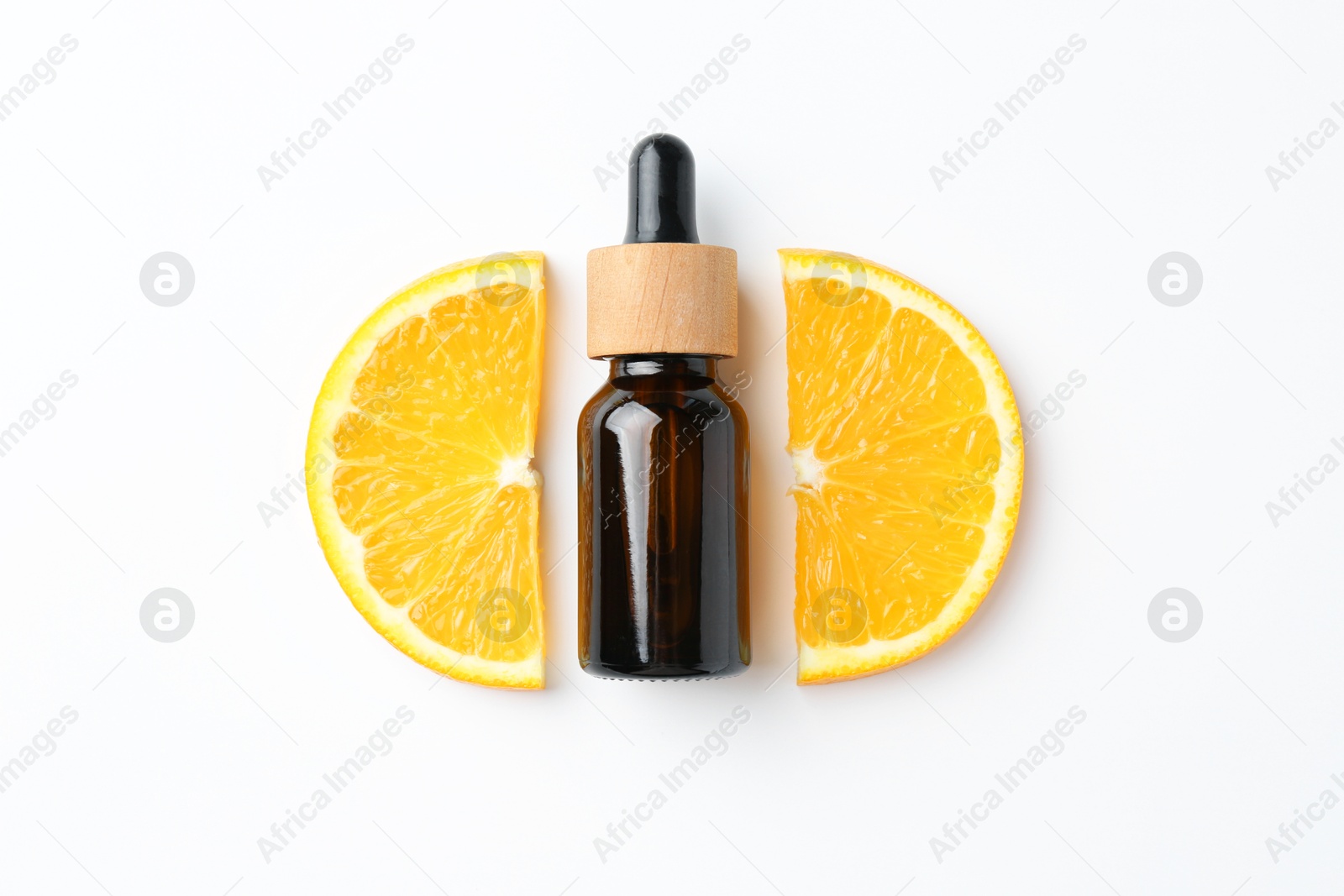 Photo of Bottle of essential oil and orange on white background, flat lay