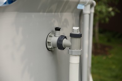 Photo of Above ground swimming pool with skimmer in garden, closeup