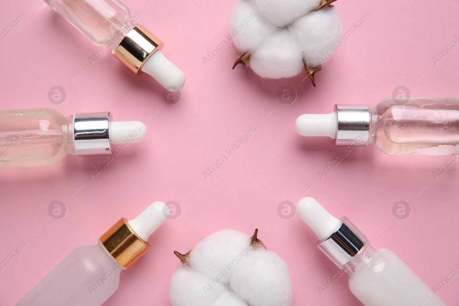 Photo of Different cosmetic products and cotton flowers on pink background, flat lay. Space for text