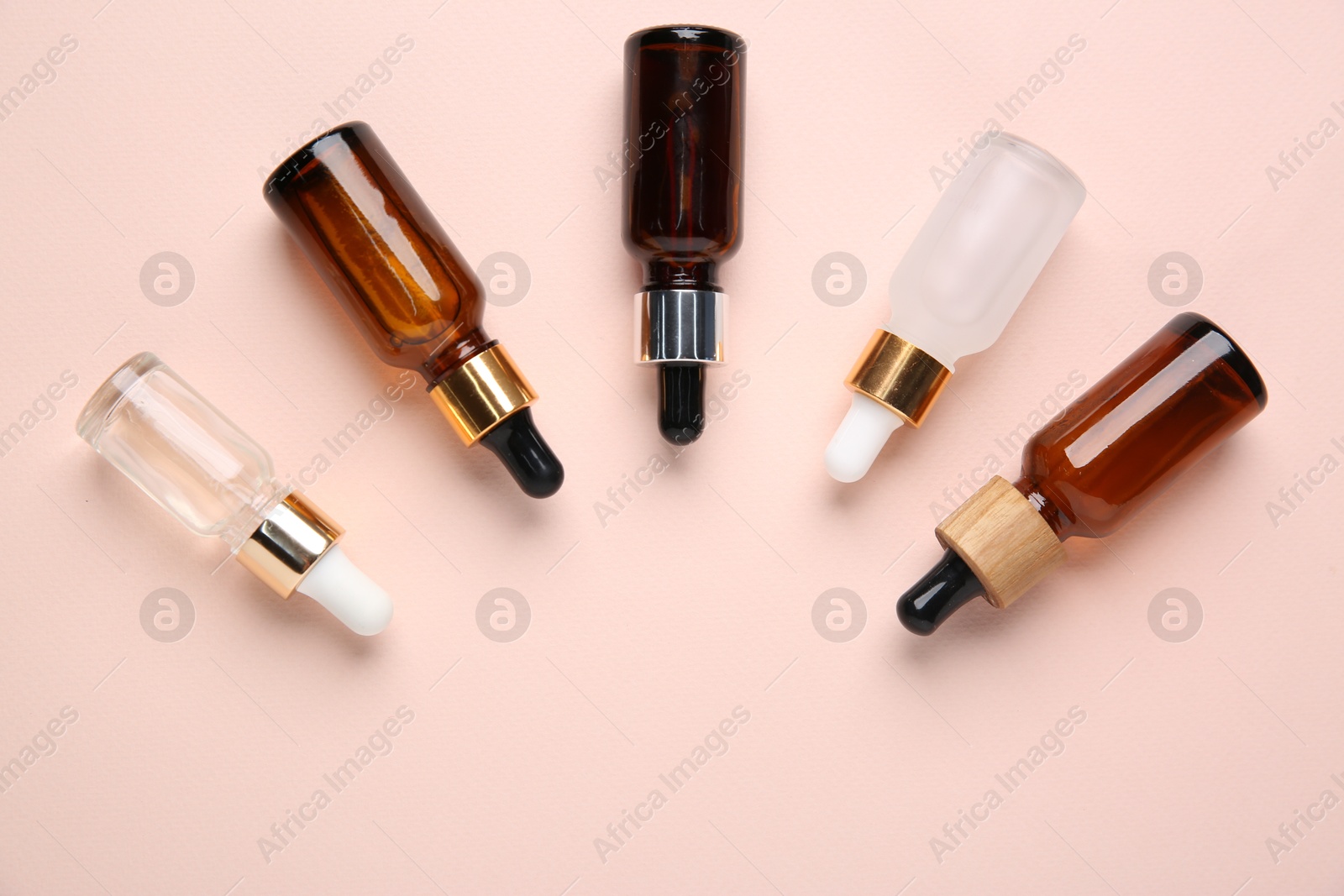 Photo of Different cosmetic products on beige background, flat lay