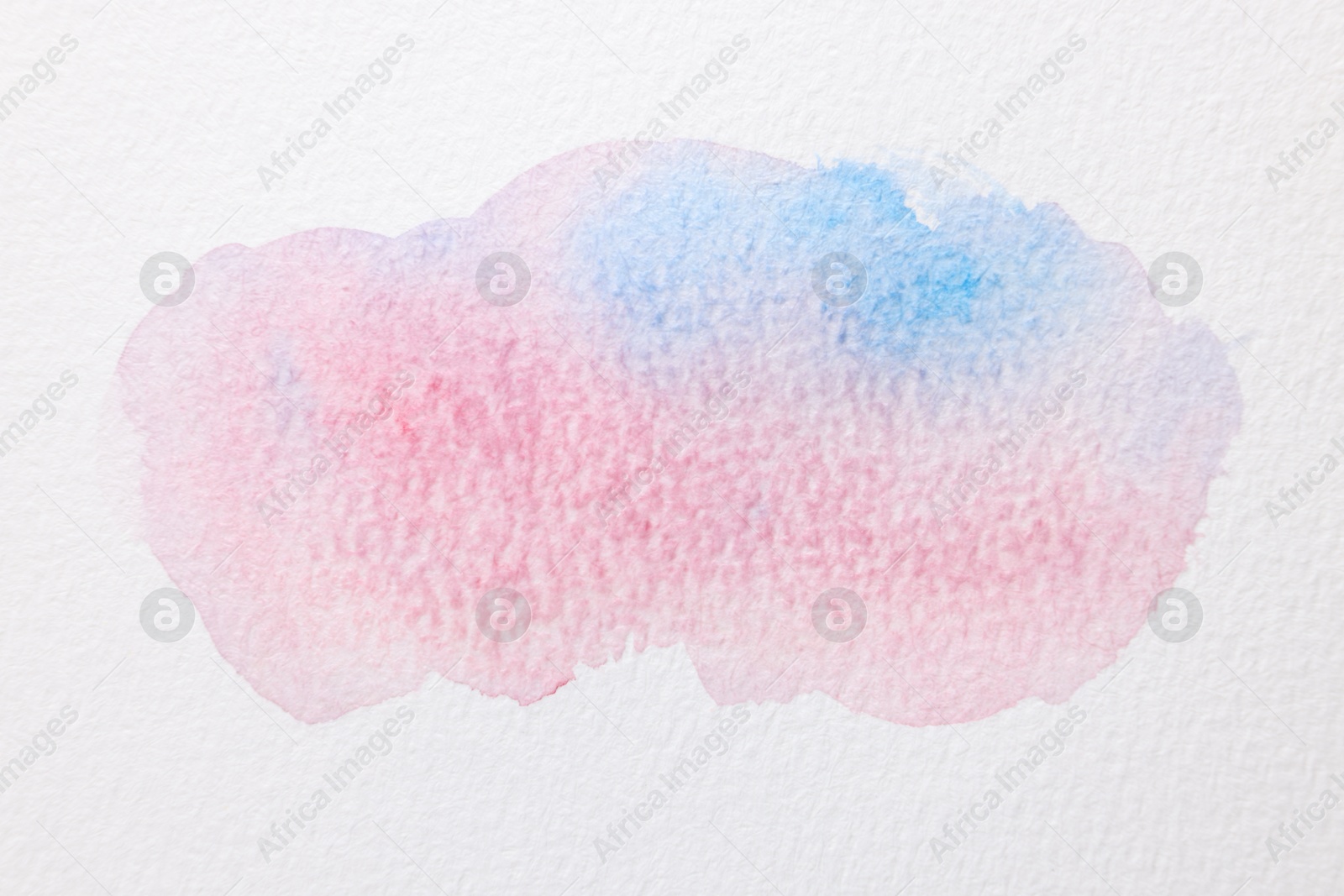 Photo of Colorful watercolor painting on white paper, top view