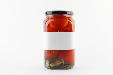 Photo of Tasty pickled tomatoes in jar on white background