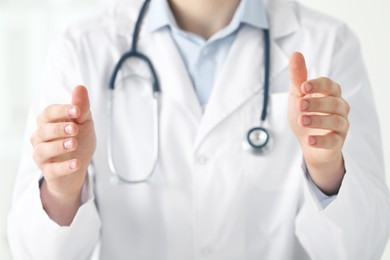 Photo of Doctor holding something in clinic, closeup view