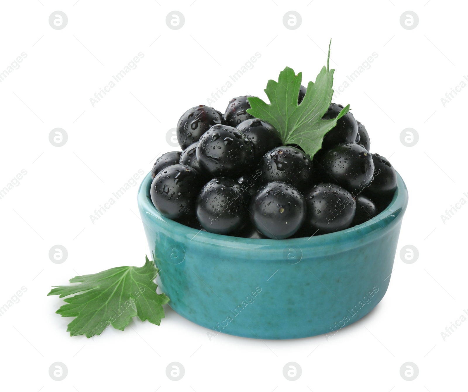 Photo of Fresh ripe black currant berries with leaves isolated on white