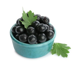 Photo of Fresh ripe black currant berries with leaves isolated on white