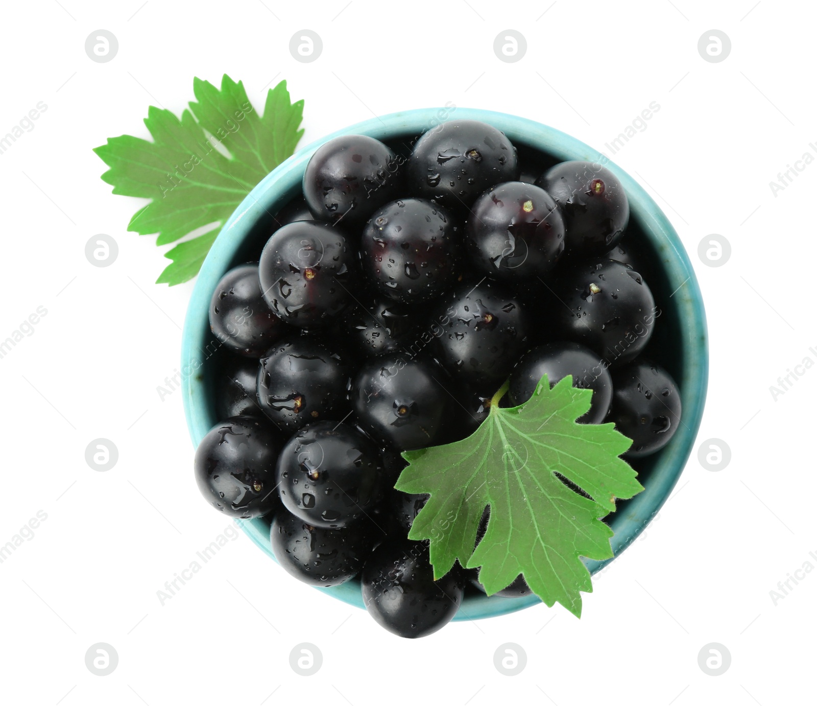 Photo of Fresh ripe black currant berries with leaves isolated on white, top view