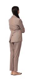 Woman in beige suit on white background