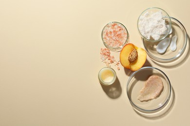 Petri dishes with different cosmetic products and peach on beige background, flat lay. Space for text