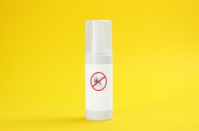 Mosquito spray on yellow background. Insect repellent