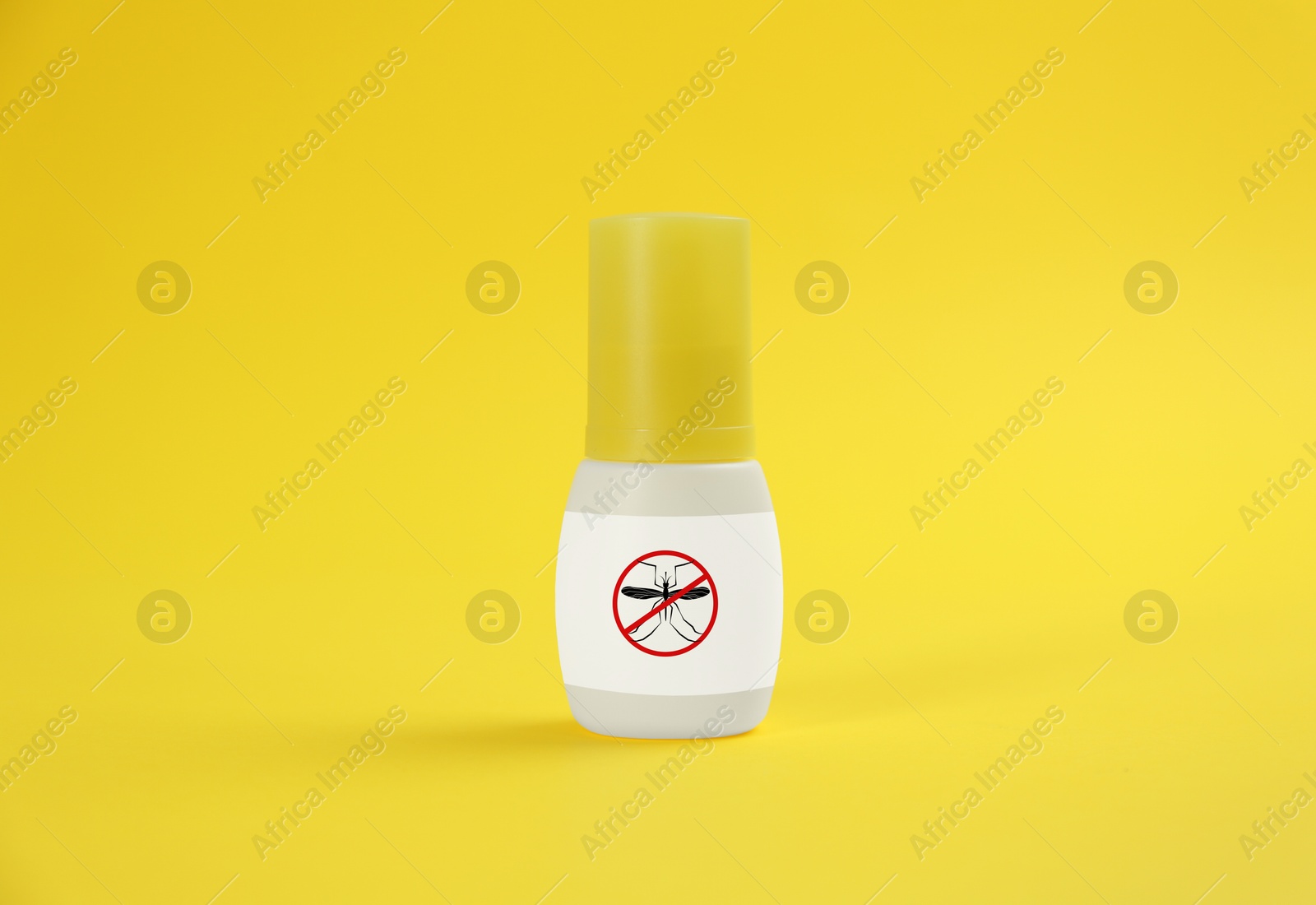 Image of Mosquito spray on yellow background. Insect repellent