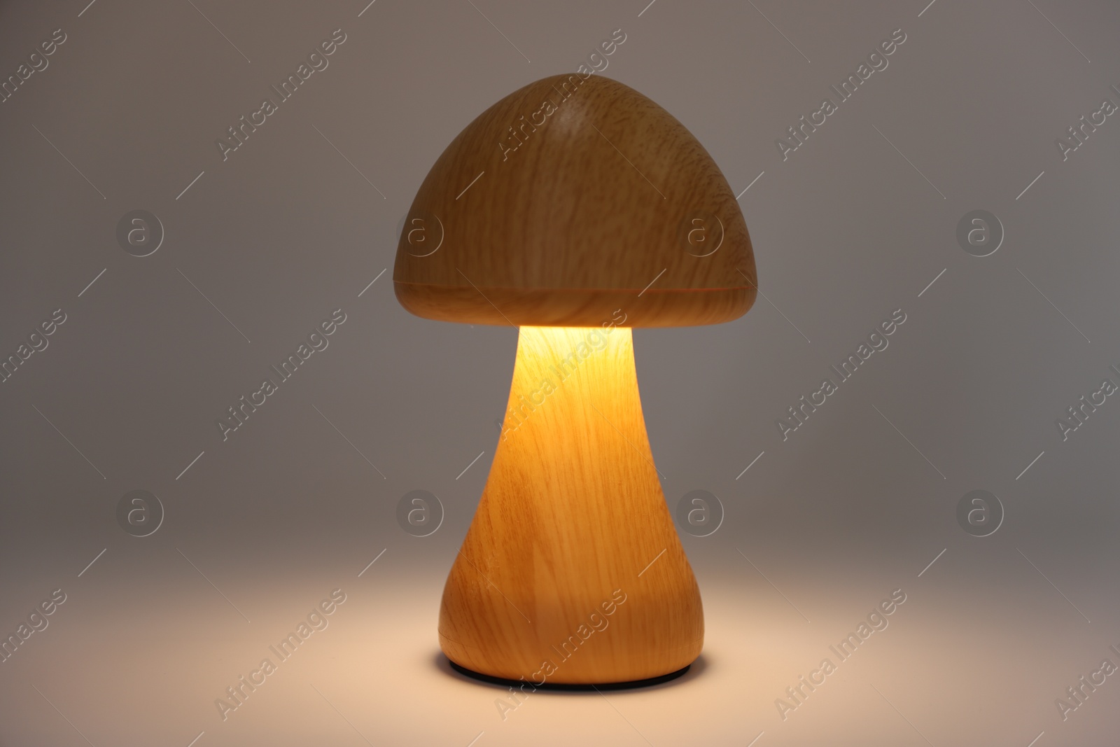 Photo of Lamp in shape of mushroom on white background