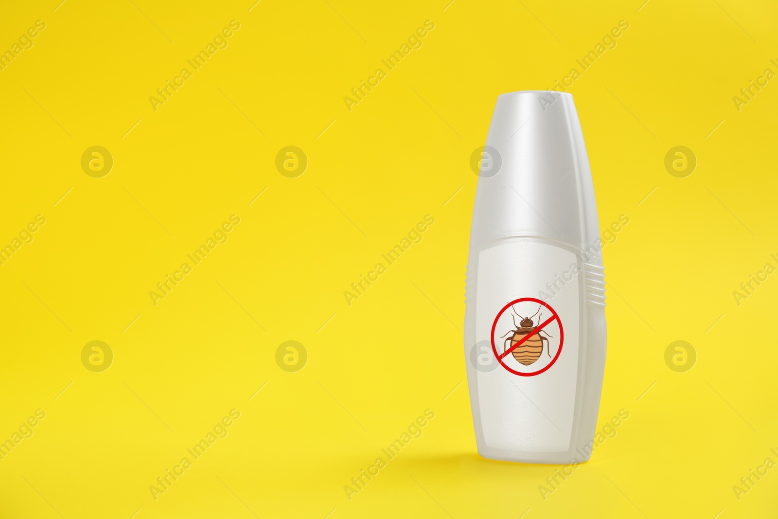 Image of Insect repellent in spray bottle on yellow background, space for text