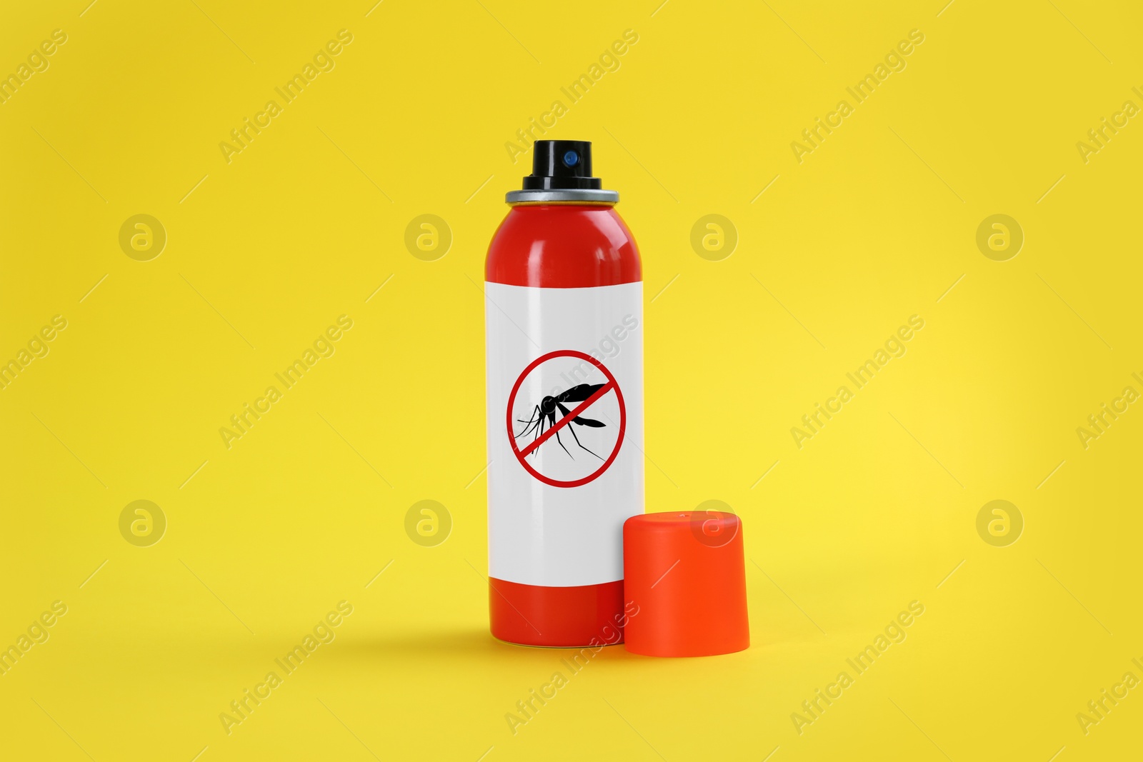 Image of Mosquito spray on yellow background. Insect repellent