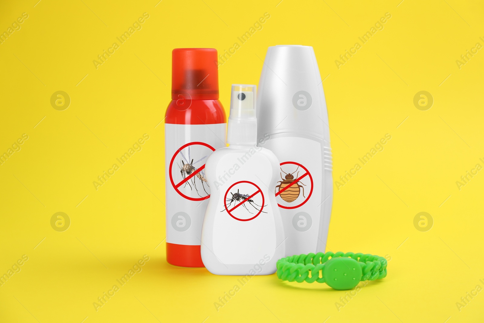 Image of Mosquito bracelet and other insect repellents on yellow background