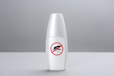 Image of Mosquito spray on grey background. Insect repellent