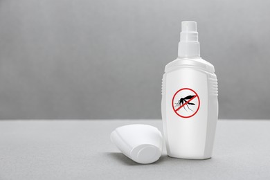 Image of Mosquito spray on grey background, space for text. Insect repellent