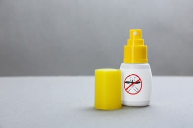 Image of Mosquito spray on grey background, space for text. Insect repellent