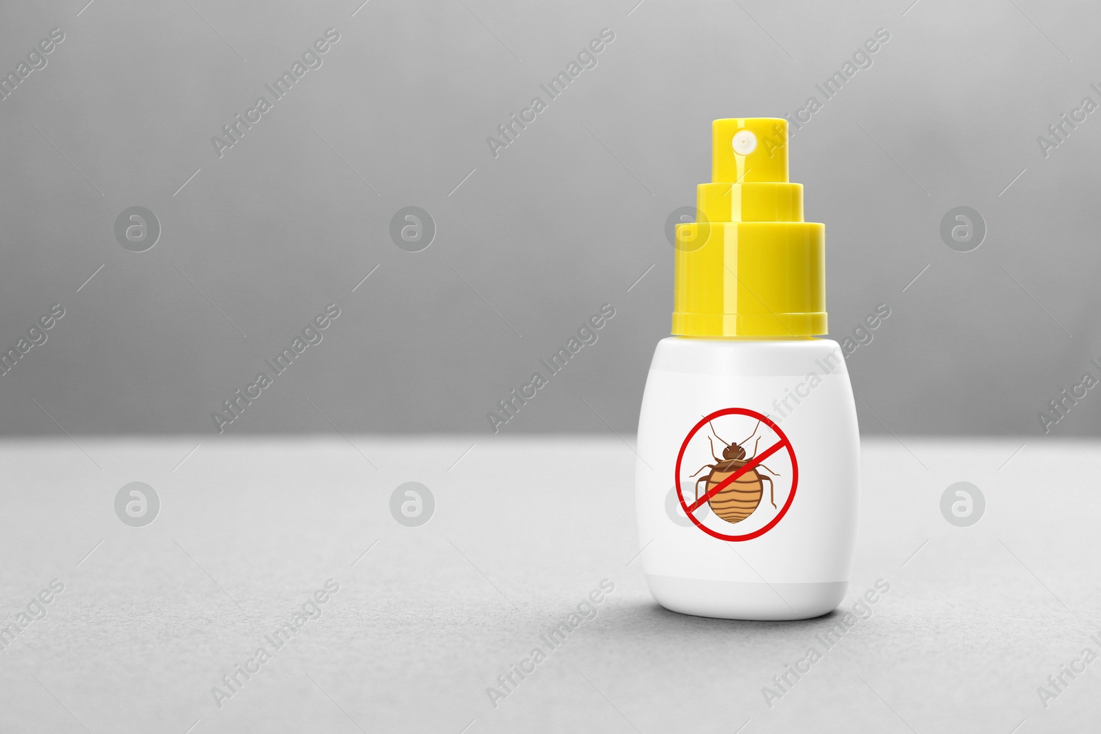 Image of Insect repellent in spray bottle on grey background, space for text