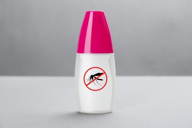 Mosquito spray on grey background. Insect repellent