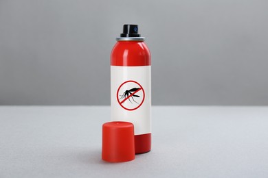 Mosquito spray on grey background. Insect repellent