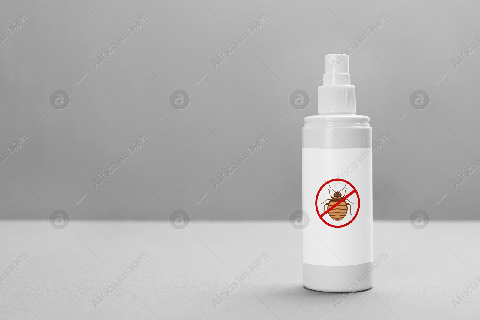 Image of Insect repellent in spray bottle on grey background, space for text