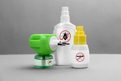 Image of Mosquito vaporizer and other insect repellents on grey background