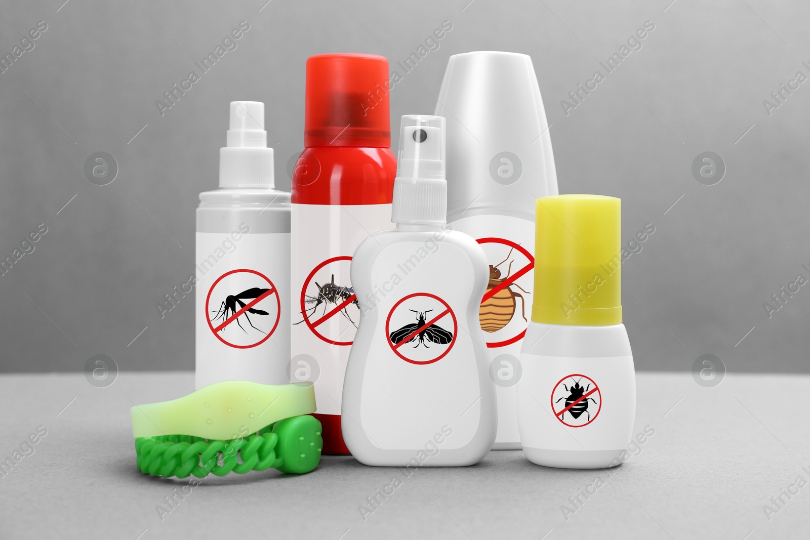 Image of Mosquito bracelets and other insect repellents on grey background