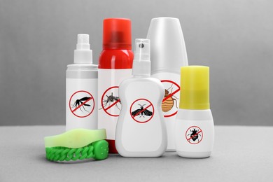 Image of Mosquito bracelets and other insect repellents on grey background