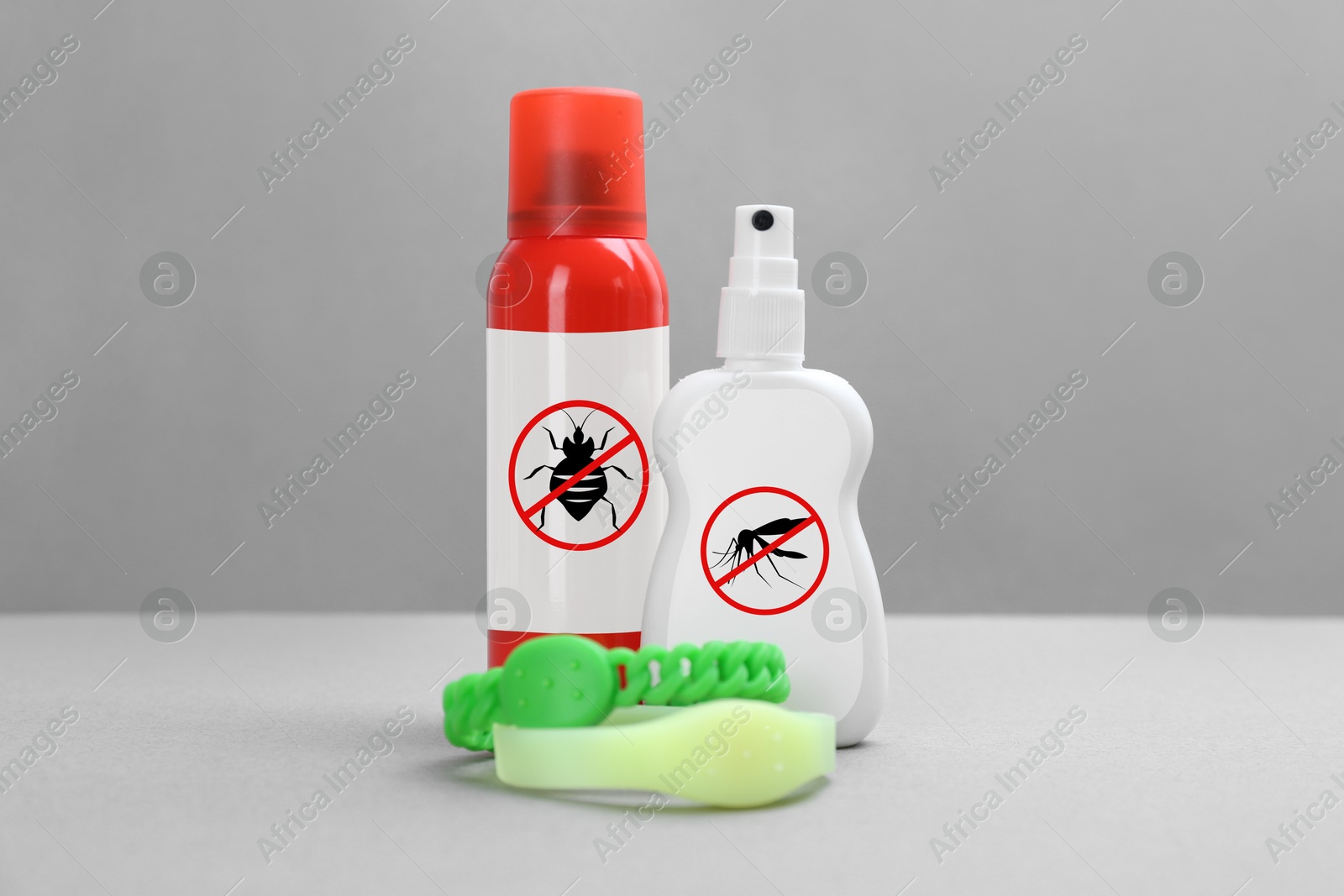 Image of Mosquito bracelets and other insect repellents on grey background