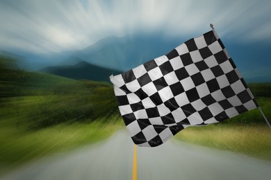 Image of Checkered finish flag and asphalt racing track outdoors