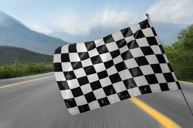 Image of Checkered finish flag and asphalt racing track outdoors