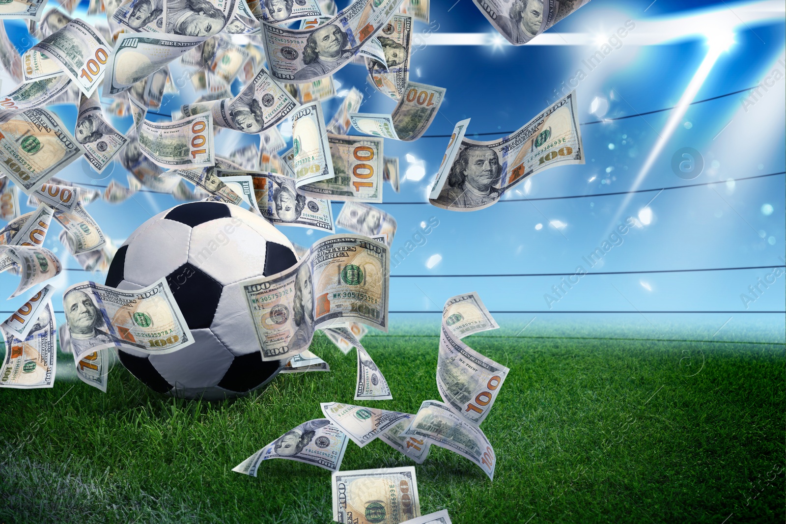 Image of Soccer ball under money rain on stadium