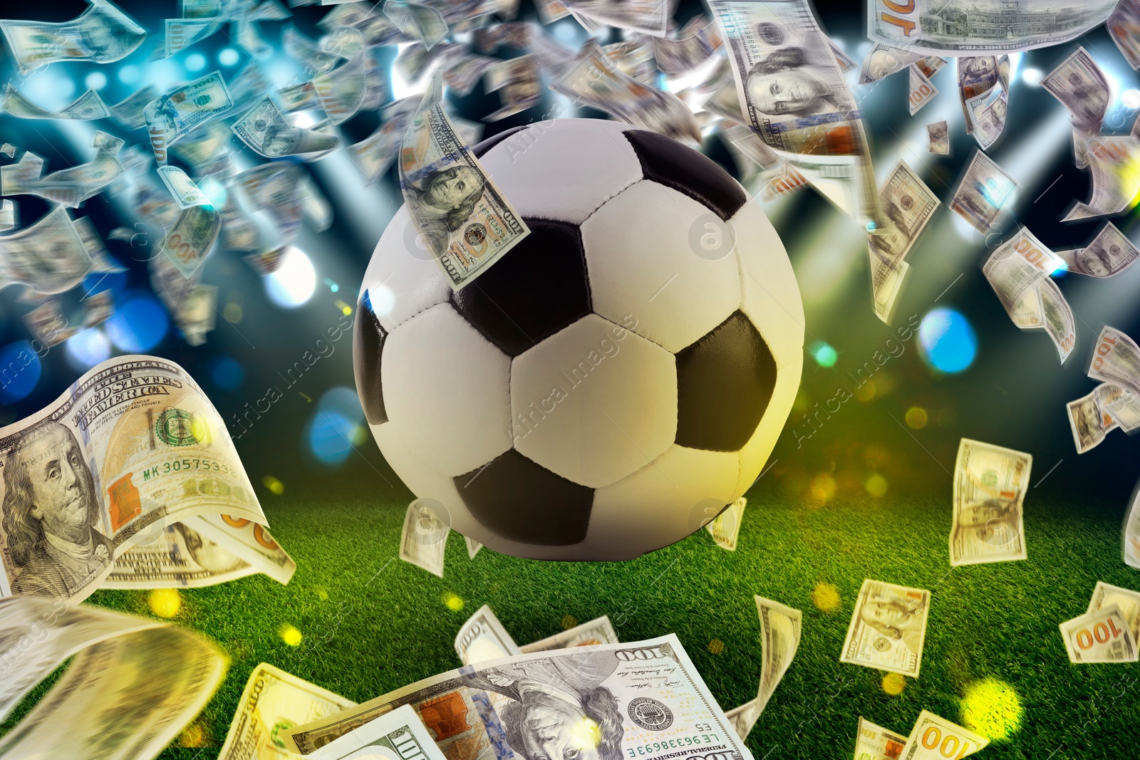 Image of Money and soccer ball in air at stadium