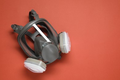 Photo of One full face respirator on red background, top view. Space for text