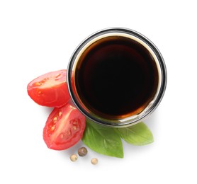 Photo of Delicious balsamic vinegar, basil, cut tomato and peppercorns isolated on white, top view