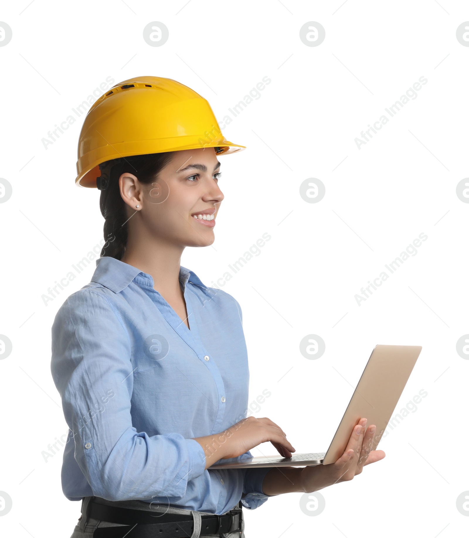 Photo of Engineer in hard hat with laptop on white background